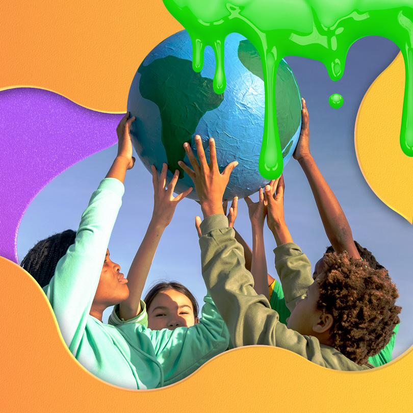 kids holding up a globe