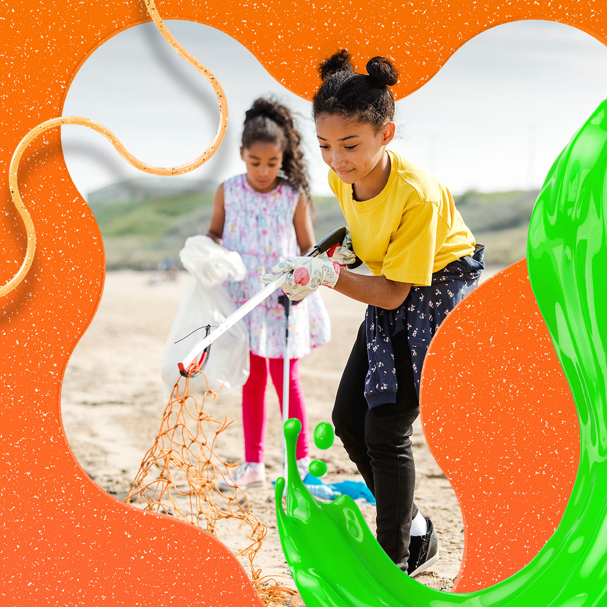 Two little girls picking up trash on a beach.